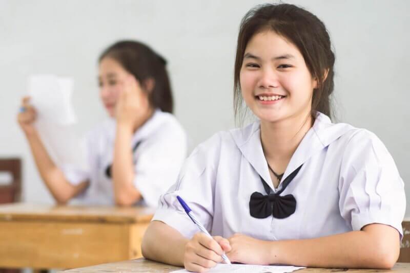 Student smiling in classroom