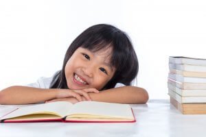 Primary student studying happily