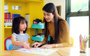 Teacher teaching a child