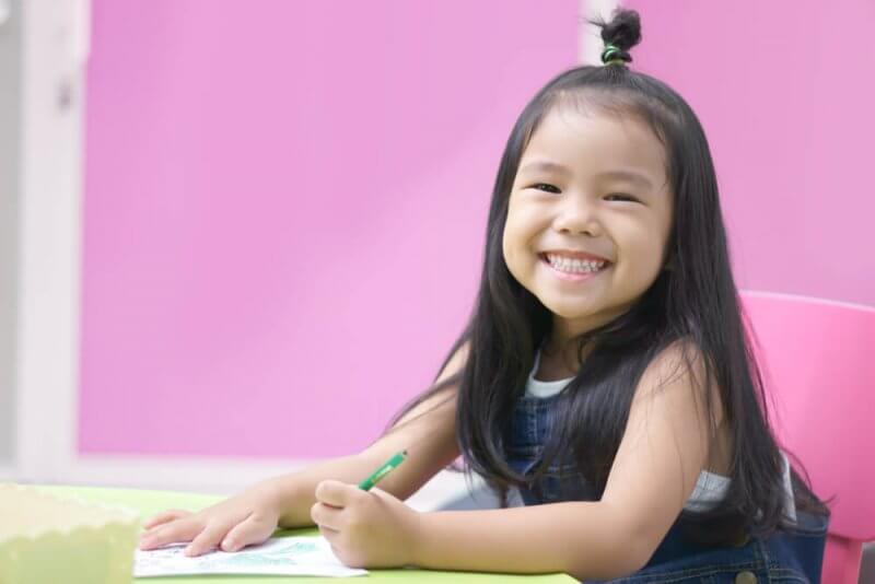 Pre School little girl smiling brightly