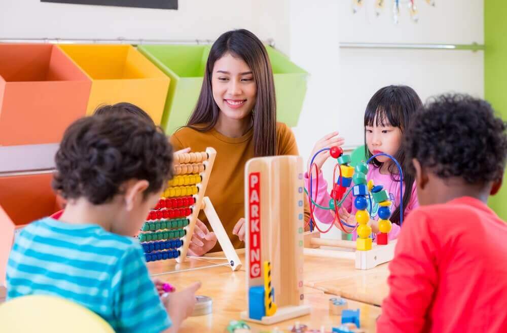 Teacher interacting with pre school kids