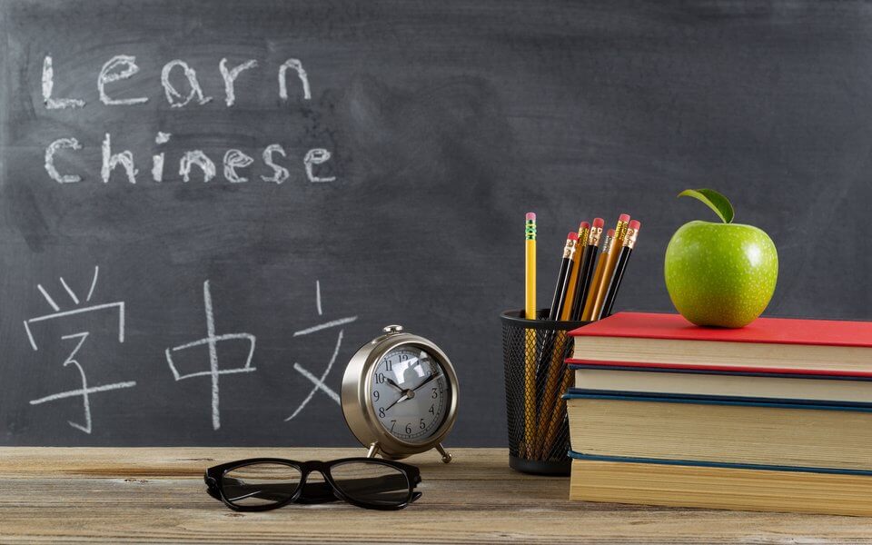Student desktop prepared to learn Chinese language
