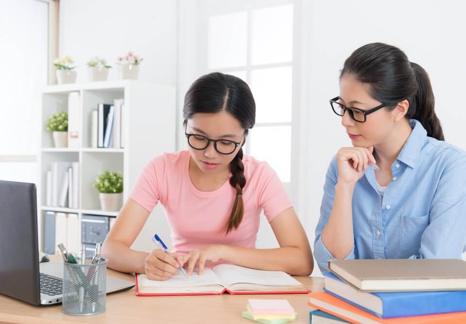 girl teenager student writing studying textbook