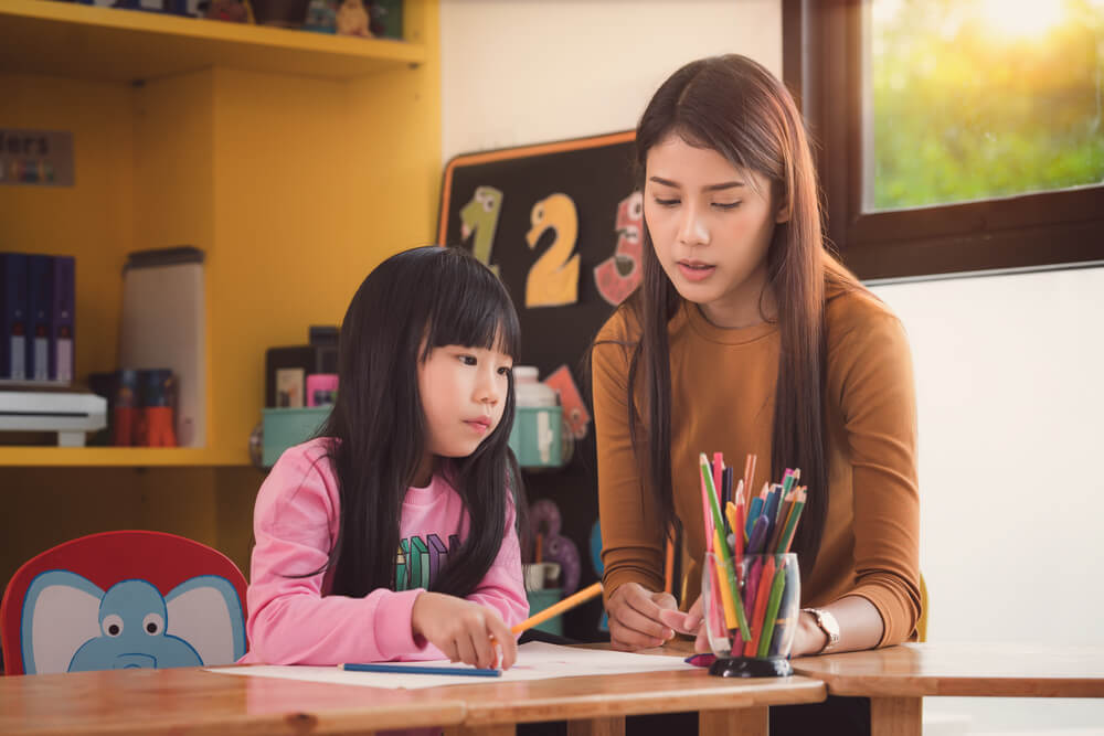 Tutor teaching a student